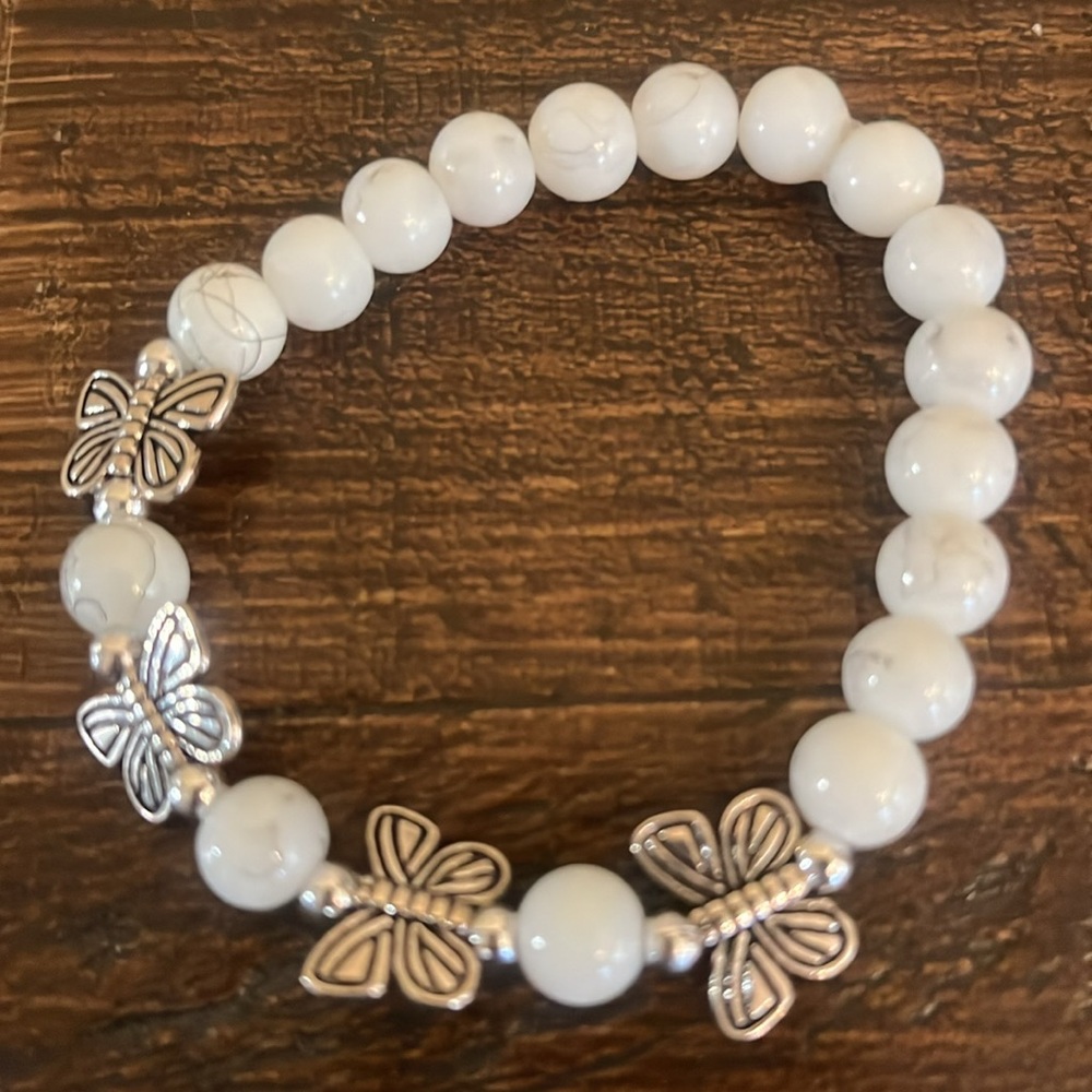 White glass bead butterfly collection. we are out or give us a gift.